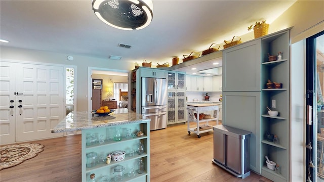 307 N Kinglet Ave, Hernando, FL 34442 - kitchen featuring open shelves, stainless steel fridge, light wood finished floors, and recessed lighting