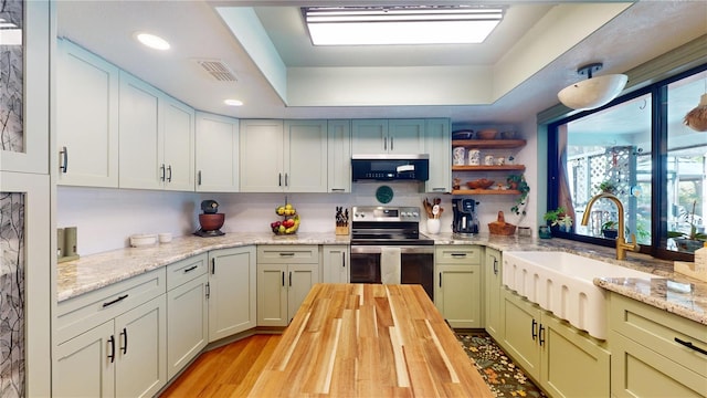 307 N Kinglet Ave, Hernando, FL 34442 - kitchen featuring appliances with stainless steel finishes, a sink, wood counters, light wood-type flooring, and open shelves
