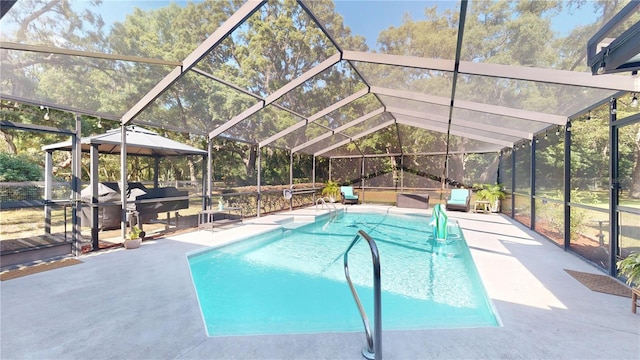 307 N Kinglet Ave, Hernando, FL 34442 - outdoor pool with a patio area, glass enclosure, and a gazebo
