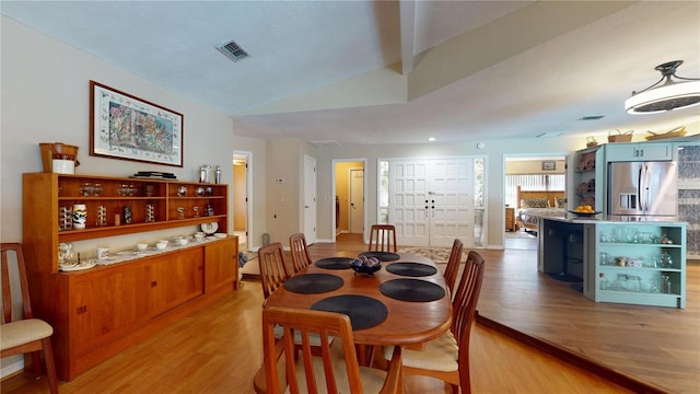 307 N Kinglet Ave, Hernando, FL 34442 - dining area featuring light wood-type flooring and lofted ceiling