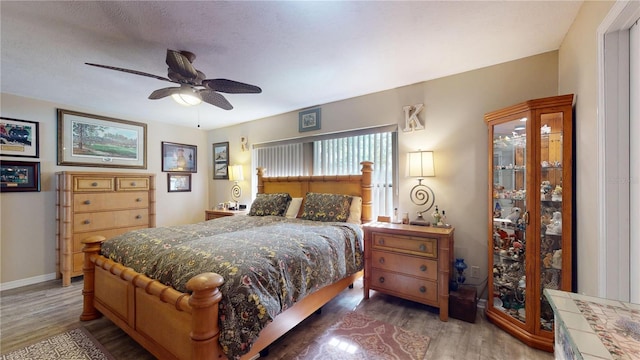 307 N Kinglet Ave, Hernando, FL 34442 - bedroom with wood finished floors, baseboards, and a ceiling fan