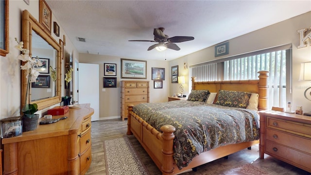 307 N Kinglet Ave, Hernando, FL 34442 - bedroom with wood finished floors, a ceiling fan, and baseboards