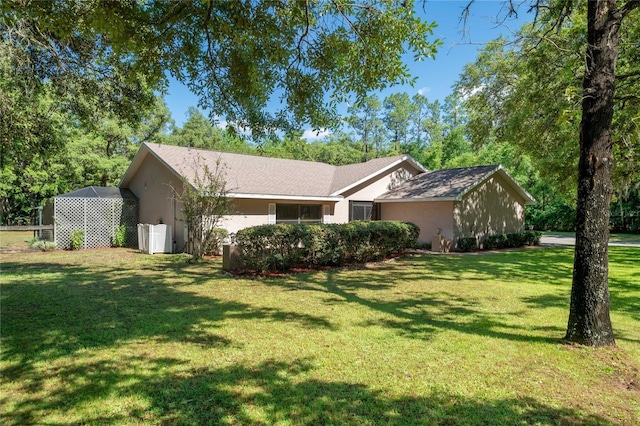 307 N Kinglet Ave, Hernando, FL 34442 - view of front of home with a front yard and stucco siding