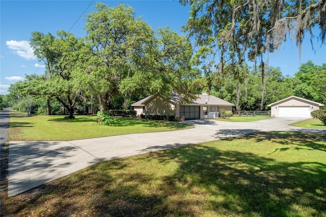 307 N Kinglet Ave, Hernando, FL 34442 - view of front of house with concrete driveway and a detached garage