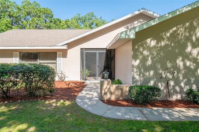 307 N Kinglet Ave, Hernando, FL 34442 - doorway to property featuring stucco siding