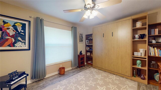 307 N Kinglet Ave, Hernando, FL 34442 - living area featuring ceiling fan, light wood finished floors, and baseboards