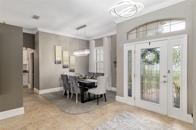 3612 SE 47th Ter, Ocala, FL 34480 - tiled dining space with a chandelier, ornamental molding, healthy amount of natural light, and baseboards