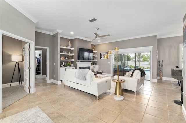 3612 SE 47th Ter, Ocala, FL 34480 - living area featuring a ceiling fan, crown molding, baseboards, recessed lighting, and light tile patterned floors