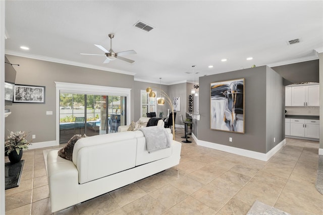 3612 SE 47th Ter, Ocala, FL 34480 - living room featuring a ceiling fan, baseboards, recessed lighting, and crown molding