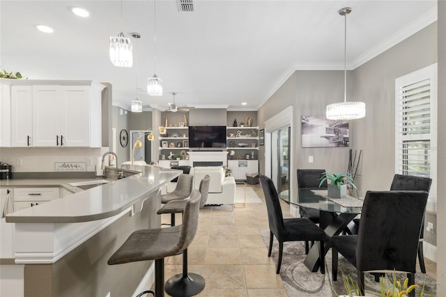 3612 SE 47th Ter, Ocala, FL 34480 - dining space featuring crown molding, a chandelier, and recessed lighting