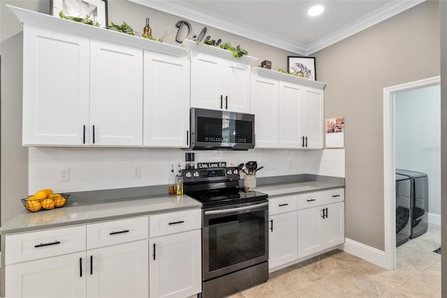 3612 SE 47th Ter, Ocala, FL 34480 - kitchen featuring appliances with stainless steel finishes, washing machine and dryer, ornamental molding, decorative backsplash, and white cabinetry
