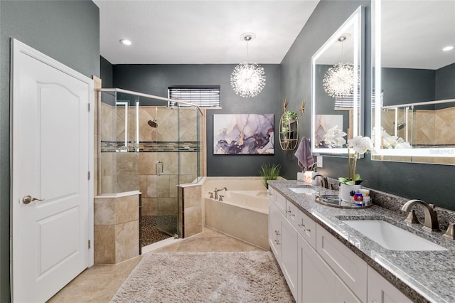3612 SE 47th Ter, Ocala, FL 34480 - bathroom with a shower stall, a chandelier, a bath, double vanity, and recessed lighting