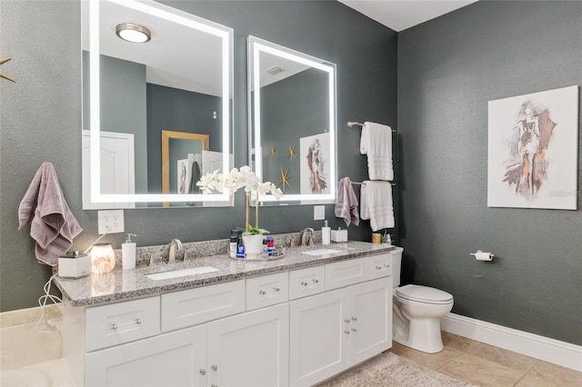 3612 SE 47th Ter, Ocala, FL 34480 - full bathroom with toilet, double vanity, baseboards, and tile patterned flooring