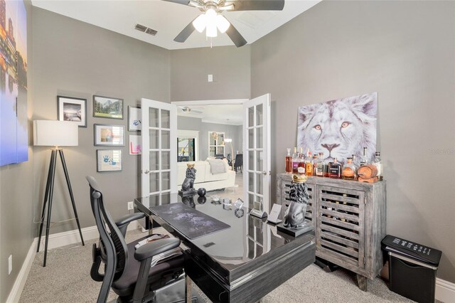 3612 SE 47th Ter, Ocala, FL 34480 - carpeted office space featuring french doors, a ceiling fan, baseboards, and a high ceiling