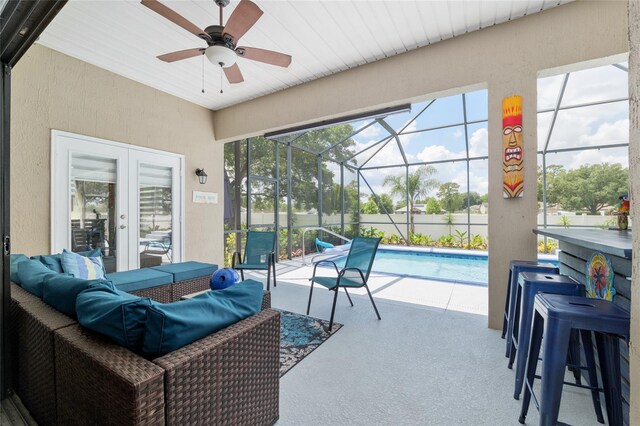 3612 SE 47th Ter, Ocala, FL 34480 - view of patio / terrace featuring an outdoor hangout area, ceiling fan, an outdoor pool, french doors, and glass enclosure