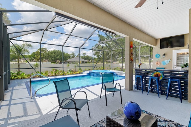 3612 SE 47th Ter, Ocala, FL 34480 - view of pool featuring a patio, a pool with connected hot tub, a ceiling fan, fence, and glass enclosure