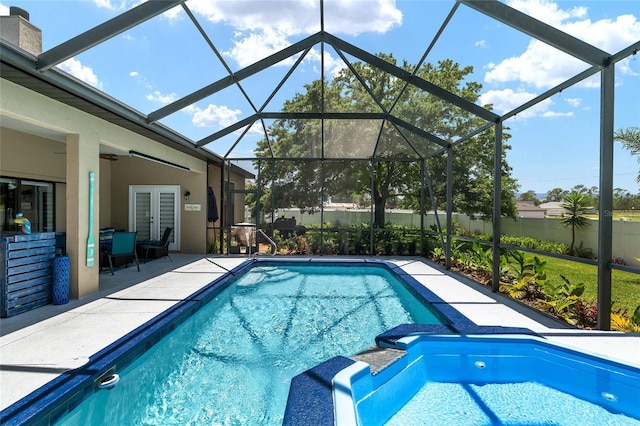 3612 SE 47th Ter, Ocala, FL 34480 - view of swimming pool with a patio area, fence, french doors, a lanai, and a pool with connected hot tub