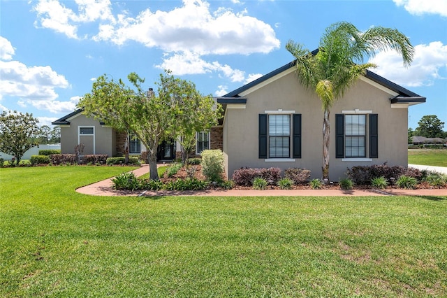 3612 SE 47th Ter, Ocala, FL 34480 - view of front of property with stucco siding and a front yard