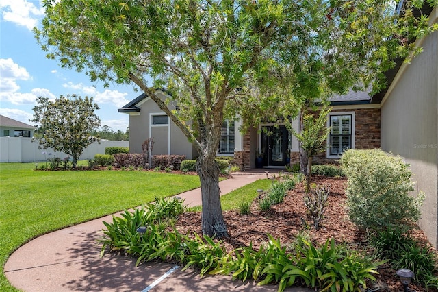 3612 SE 47th Ter, Ocala, FL 34480 - view of property hidden behind natural elements featuring stone siding