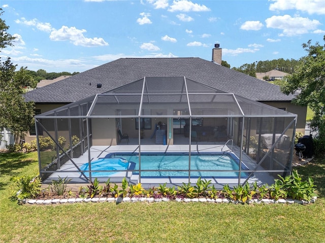 3612 SE 47th Ter, Ocala, FL 34480 - rear view of property with a patio area, an outdoor pool, roof with shingles, a lawn, and a lanai