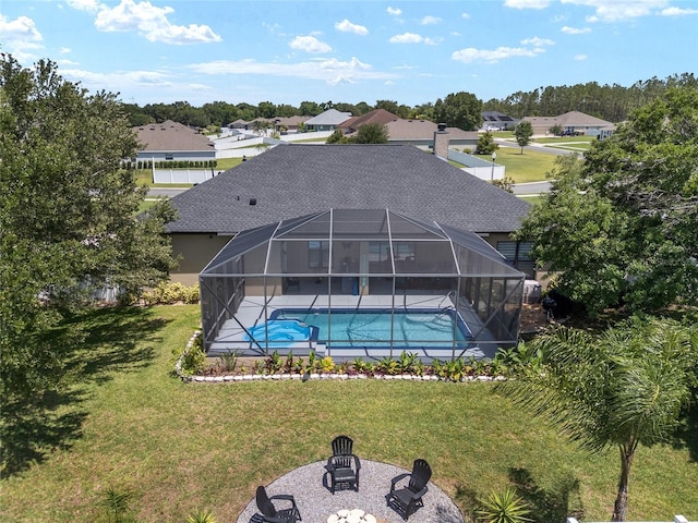 3612 SE 47th Ter, Ocala, FL 34480 - swimming pool featuring a patio, a fire pit, and a lawn