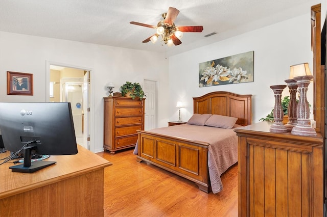 17576 SE 96th Ct, Summerfield, FL 34491 - bedroom with light wood finished floors, an office area, and a ceiling fan