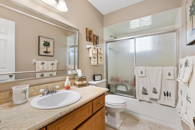 17576 SE 96th Ct, Summerfield, FL 34491 - full bathroom with vanity, toilet, and combined bath / shower with glass door