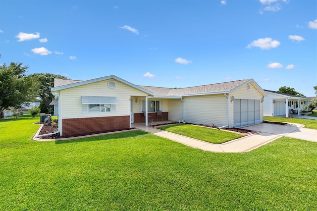 17576 SE 96th Ct, Summerfield, FL 34491 - single story home featuring driveway, a front lawn, an attached garage, and central air condition unit
