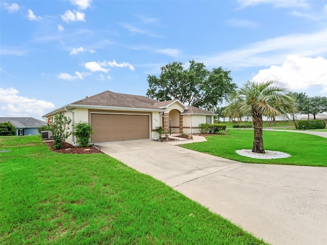 17233 SE 115th Terrace Rd, Summerfield, FL 34491 - single story home with stucco siding, concrete driveway, a front lawn, a garage, and central AC