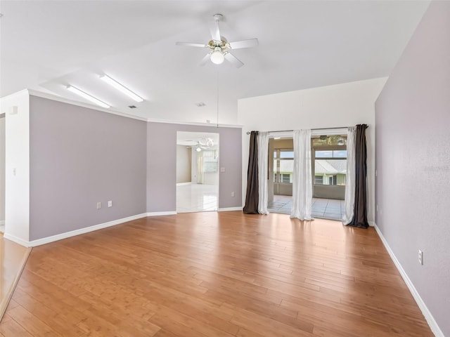 17233 SE 115th Terrace Rd, Summerfield, FL 34491 - spare room with a ceiling fan, light wood-style floors, and baseboards