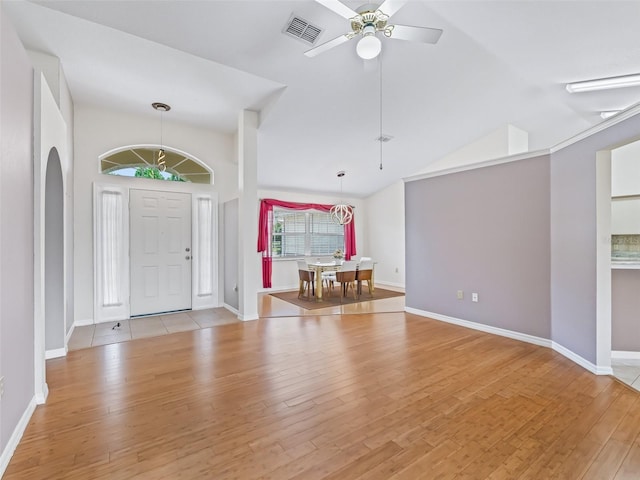 17233 SE 115th Terrace Rd, Summerfield, FL 34491 - entrance foyer featuring light wood-type flooring, ceiling fan, baseboards, and lofted ceiling
