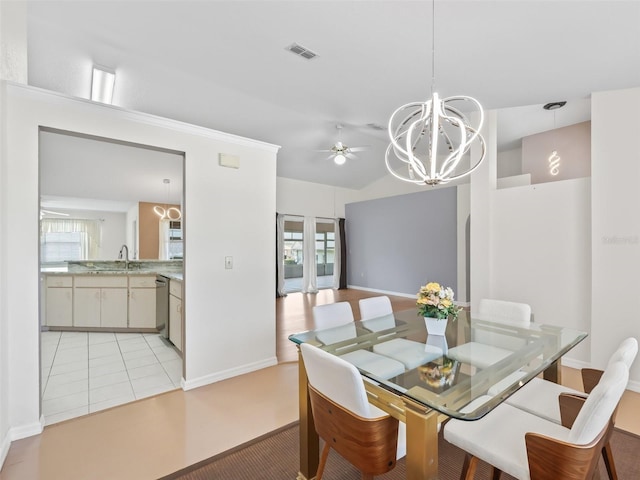 17233 SE 115th Terrace Rd, Summerfield, FL 34491 - dining room with ceiling fan, a chandelier, baseboards, and light tile patterned flooring