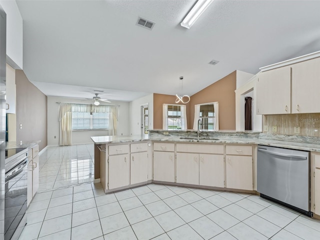 17233 SE 115th Terrace Rd, Summerfield, FL 34491 - kitchen featuring dishwasher, a sink, vaulted ceiling, a peninsula, and a ceiling fan