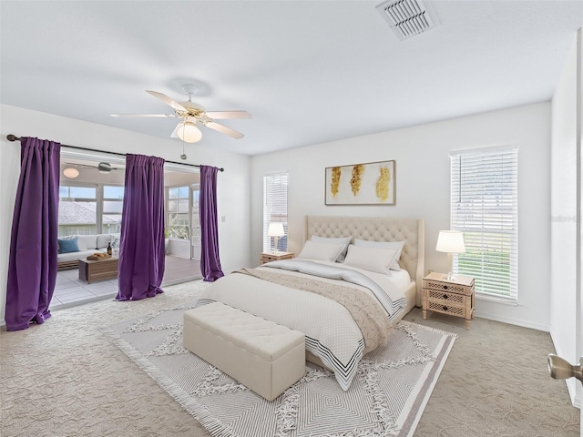 17233 SE 115th Terrace Rd, Summerfield, FL 34491 - carpeted bedroom with multiple windows, ceiling fan, and baseboards