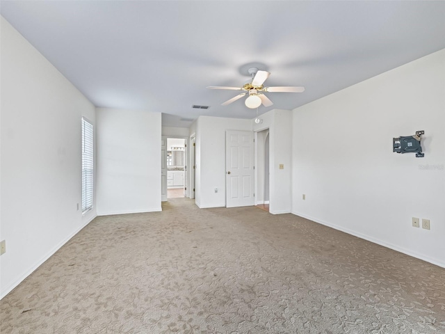 17233 SE 115th Terrace Rd, Summerfield, FL 34491 - unfurnished bedroom featuring carpet flooring, baseboards, connected bathroom, and ceiling fan