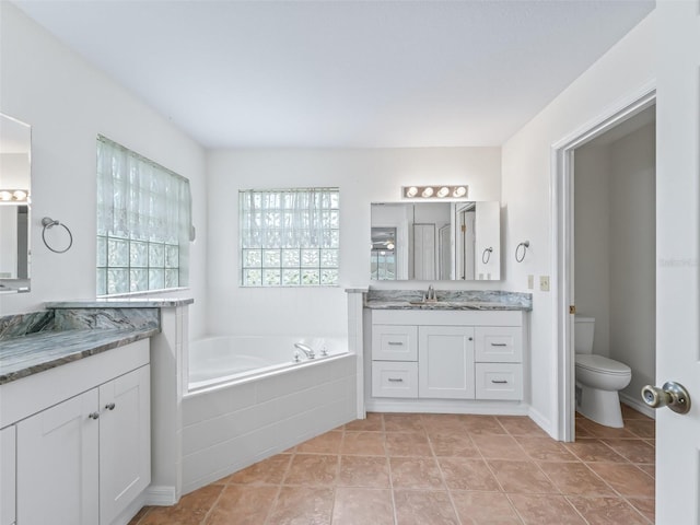 17233 SE 115th Terrace Rd, Summerfield, FL 34491 - full bath featuring a bath, toilet, tile patterned floors, and vanity
