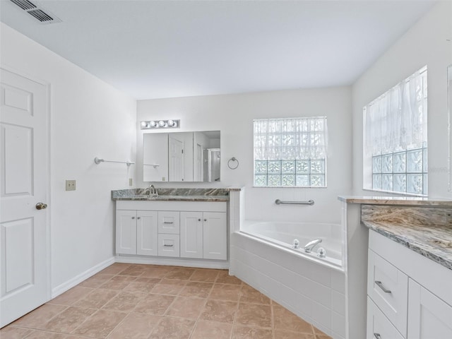 17233 SE 115th Terrace Rd, Summerfield, FL 34491 - bathroom featuring a garden tub and vanity