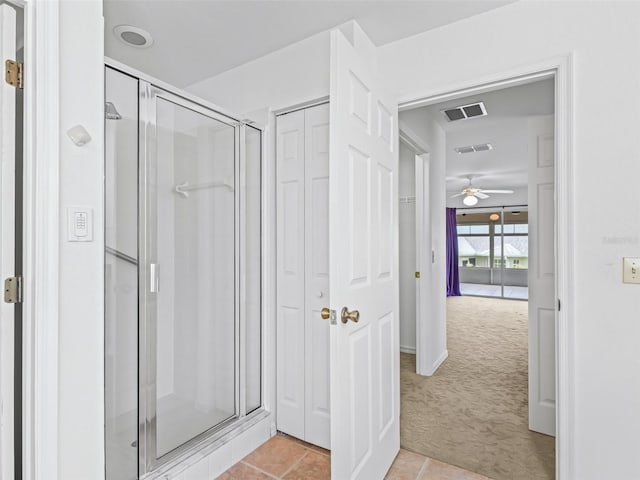 17233 SE 115th Terrace Rd, Summerfield, FL 34491 - bathroom with a stall shower, a ceiling fan, and tile patterned floors