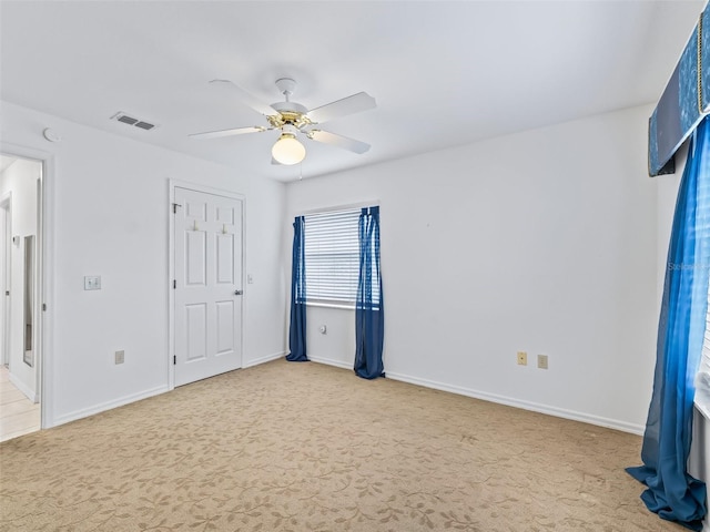 17233 SE 115th Terrace Rd, Summerfield, FL 34491 - unfurnished bedroom with carpet, a ceiling fan, and baseboards