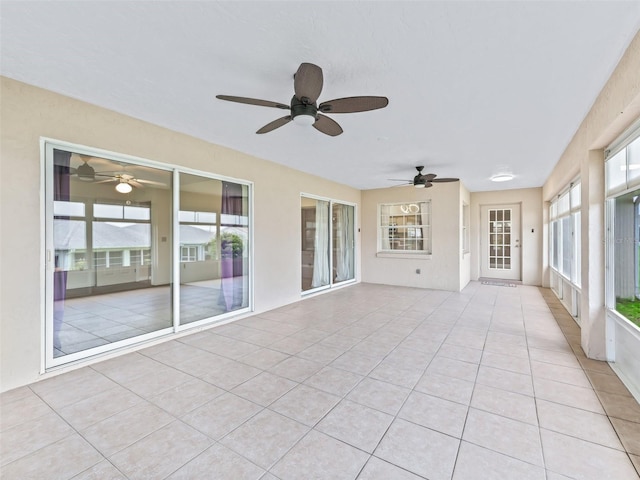17233 SE 115th Terrace Rd, Summerfield, FL 34491 - unfurnished sunroom with ceiling fan and tile patterned flooring