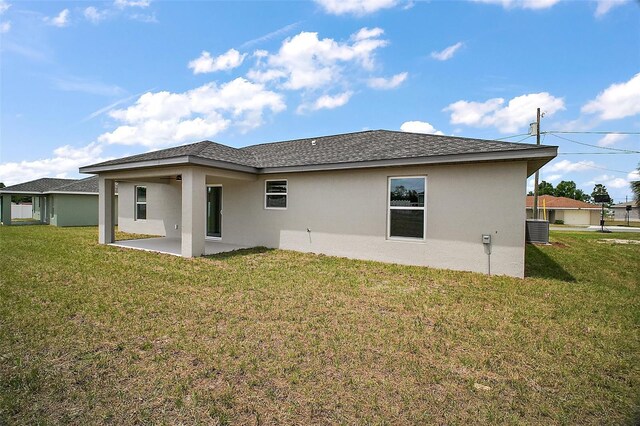 20 Emerald Trl, Ocala, FL 34472 - back of house featuring a patio area, stucco siding, and a yard