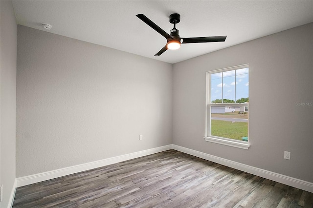 20 Emerald Trl, Ocala, FL 34472 - empty room featuring wood finished floors, ceiling fan, baseboards, and a smoke detector
