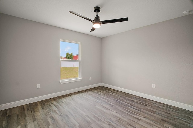 20 Emerald Trl, Ocala, FL 34472 - empty room with wood finished floors, a ceiling fan, and baseboards