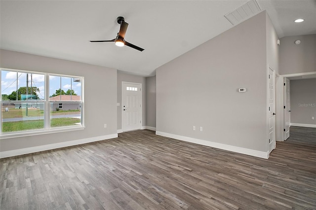 20 Emerald Trl, Ocala, FL 34472 - unfurnished living room featuring lofted ceiling, a ceiling fan, dark wood-style flooring, baseboards, and recessed lighting