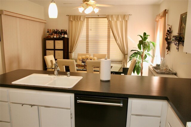 8735 SW 192nd Court Rd, Dunnellon, FL 34432 - kitchen with black dishwasher, a sink, dark countertops, and ceiling fan