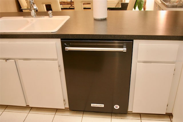 8735 SW 192nd Court Rd, Dunnellon, FL 34432 - kitchen with dishwashing machine, a sink, dark countertops, and white cabinets