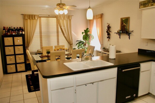 8735 SW 192nd Court Rd, Dunnellon, FL 34432 - kitchen with a sink, black dishwasher, light tile patterned flooring, ceiling fan, and dark countertops