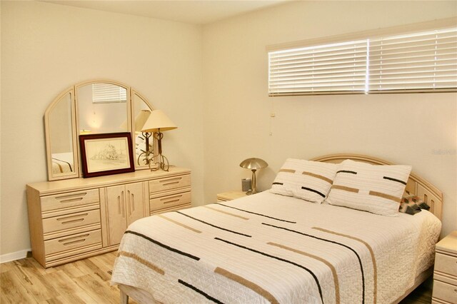 8735 SW 192nd Court Rd, Dunnellon, FL 34432 - bedroom with light wood finished floors and baseboards