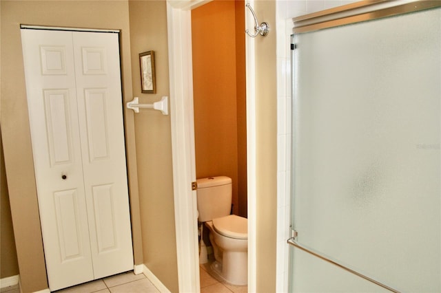 8735 SW 192nd Court Rd, Dunnellon, FL 34432 - full bathroom with tile patterned flooring, toilet, a stall shower, and baseboards