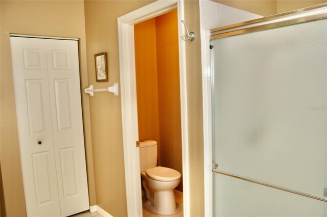 8735 SW 192nd Court Rd, Dunnellon, FL 34432 - bathroom featuring toilet and a stall shower